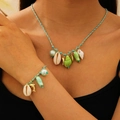 Bohemian seashell and starfish necklace with blue rope and ceramic charms on model - Green Necklace and Bracelet Set