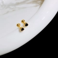 Macro detail of heart-shaped black zircon earrings with screw ball backing in gold finish - Heart / Gold