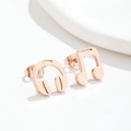 Music themed rose gold asymmetrical stud earrings featuring headphone and note designs - Music Note Rose Gold