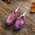 Detail of purple imperial stone teardrop earrings with gold hooks on natural rock - Light Purple Stone Gold Color Hook
