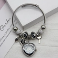 Detail of silver beaded bracelet watch with heart-shaped dial, rose and key charms - White