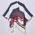 Detail of color-block striped poncho with fringe tassels in blue, white, and red knit - Horizontal Striped Tassel Side Tie / Navy Red