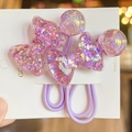 Detail of high-elastic purple hair ties featuring glitter bows and resin balls - Violet