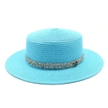 Close-up of bright blue straw boater hat with silver sequin band and metallic M logo - M (56-58cm) / Lake Blue