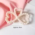Fermaglio per capelli con fiocco a cuore e perle