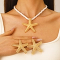 Fashionable gold starfish necklace and earrings set with textured finish for beach vacations - Gold Starfish Jewelry Set (New)