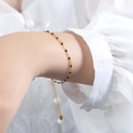 Bohemian gold chain bracelet featuring black enamel beads and adjustable clasp - Bracelet / Black