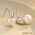Macro shot showing 1.19cm pearl and silver stainless steel drop earring details - 18K Gold / Silver Pearl Hook Earrings