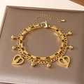 Double-layered gold stainless steel bracelet with hollow heart charms and beads - Heart Mother Child Silhouette Style (KB203673-Z)