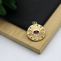 Gold round pendant featuring a red gemstone eye pattern with multi-color stone inlay - Radial Pattern Eye Round Charm Style