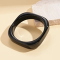 Detail of a minimalist black chunky resin bangle with a polished square silhouette - Bangle - Black Square