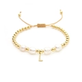 Detail view of baroque pearl bracelet with gold beads and letter L pendant - Letter L