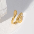 Detailed view of adjustable golden snake ring with textured scales on white rock base - Gold Realistic Style (JR152)
