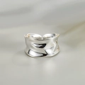Close-up of a silver irregular wrinkled texture ring with an adjustable open design - Adjustable Open / Silver