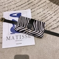 Fashionable zebra print waist bag with black leather strap and gold circular metal buckle - Black White Zebra