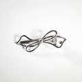 Silver alloy hollow bow hair clip with minimalist metallic design on a white background - Silver Outline Bow