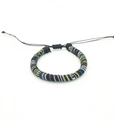 Detail of bohemian hand-woven surfing bracelet with colorful stripes and adjustable knot - US 4