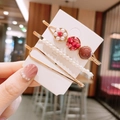 Detailed view of three elegant pearl and rhinestone hair clips on a white display card - A116-02# Red Pearl 3-Piece Set