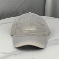 Close-up of distressed cotton baseball cap with Heart embroidery and ripped visor detail - Gray