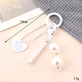 Detail view of a white pearl bow keychain showing 10cm length and 17g weight specs - Small Pendant / Artificial Pearl Round Bead Chain Charm(K4615)