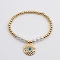 Bracciale di perle dorate e bianche con ciondolo a forma di occhio greco smaltato - 0801YS-Malocchio in Smalto