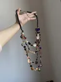 Detail of bohemian multilayer long necklace with colorful shell discs and black beads - Dark Wood Beads Colorful Disc Ethnic Multilayer Necklace