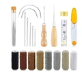 Leather sewing tool kit with wax threads, needles, awls and scissors on white background - EU 22