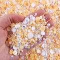 Close-up of mixed half-round pearls and AB color rhinestones for DIY nail art and crafts - 30 g / White Orange Yellow Series-05