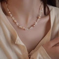 Rice freshwater pearl and peach crystal necklace on model's neckline in gold - Pink Pearl Stone Gold Chain Style (D-e-024)