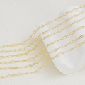 Macro detail of 18K gold-plated oval paperclip chain links for DIY jewelry making - 14K Edge-cut Style (1.5mm) / 1m