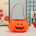 Orange felt Halloween pumpkin bag for kids trick-or-treating with a spooky face - Pumpkin Bag D