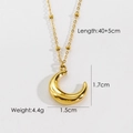 Detail view of gold moon pendant necklace with dimensions 1.7x1.5cm and length 40+5cm - Moon