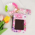 Detail of floral printed ID card holder with colorful silicone beads and a tassel keychain - Black Floral