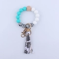 Silicone bead keychain bracelet with cow print leather tassel and mint green beads - White Leopard Print