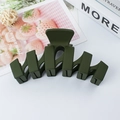 Matte dark green wavy hair claw clip for women displayed on a clean minimalist desk - Army Green