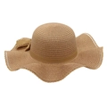 Macro detail of brown wide-brim raffia sun hat with wavy edges and decorative bow - Khaki