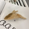 Detail of whale hair claw clip showing marble acetate texture and gold outlines - Brown Whale