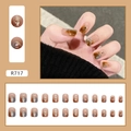 Macro detail of amber marble press-on nails R717 with gold foil and 24pc set layout - R717 Cat Eye Amber