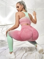 Close-up of pink and green gradient leggings featuring seamless push-up and peach lift design - Watermelon red