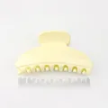 Elegant pale yellow resin hair claw clip with smooth crescent design for thin hair - Off White