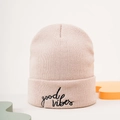 Detail of light pink beanie featuring black hand-written Good Vibes embroidery - Beige