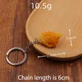 Realistic fried chicken nugget keychain with silver metal ring on a wooden tray - Painted Popcorn Chicken