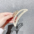 Detail of gold metal hair claw clip with inlaid pearls and sparkling rhinestones - Moon Mixed Colors