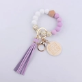 Close-up of silicone beads and tassel keychain featuring engraved MAMA wooden charm - Light Purple