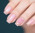 Detail of pink pearlescent press-on nails with rose gold glitter tips and 3D heart charms - CW769-Iridescent Pink 3D Heart
