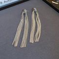 Detailed close-up of silver knotted tassel earrings featuring sleek metallic snake chains - Classic Knot Snake Chain Tassel Style (Silver Post)
