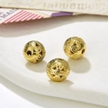 Macro shot of three hollow vintage gold round spacer beads for DIY jewelry making - Style 2