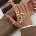 Punk style gold scorpion joint ring with rhinestones on a female model hand - Gold Scorpion Slave Ring Style (DZ-629)