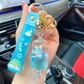 Blue liquid quicksand keychain featuring a cute unicorn in a candy shaped container - Blue-Fruit Candy Unicorn