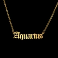 Macro detail of golden Aquarius gothic letter pendant on a delicate O-chain necklace - Aquarius - Gold